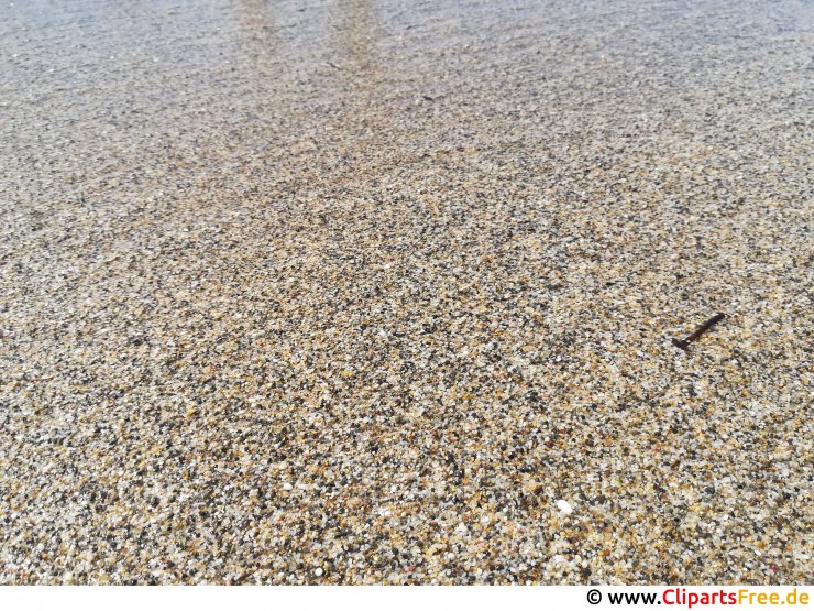 Körniger Sand am Meeresstrand Foto