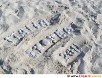 Buchstaben auf dem Sand im Urlaub Foto